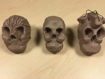 Three skull sculptures seen from above